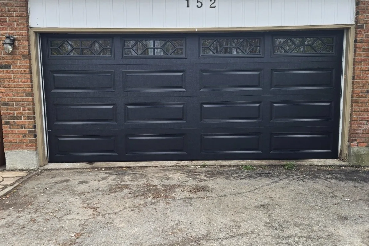 Modern Kanata suburban home with a charcoal insulated double garage door